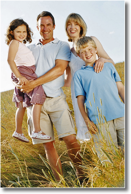 picture of a happy family hiking in a field